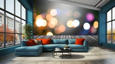 image of wood table and blurred bokeh background with colorful lights . Wall mural