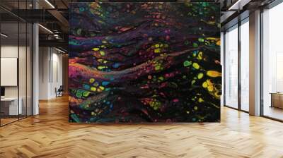 Closeup section of a black abstract acrylic swipe painting with numerous bright colored cells popping up throughout. Wall mural