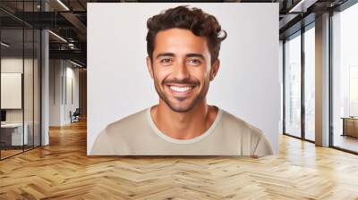 Frontal portrait of smiling young man with Hispanic features with brown skin and light beard. Wall mural