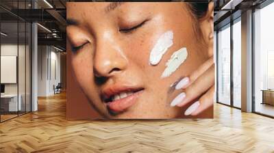 Facial skincare with exfoliating cream Wall mural