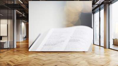 Closeup, bible or book for faith, studying religion and mindfulness with holy spiritual scripture. Christian literature, background or learning story for education or knowkedge on God or Jesus Christ Wall mural