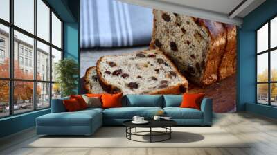 sliced cinnamon raisin bread on a wooden board Wall mural