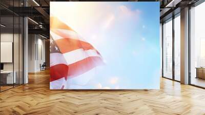 A large American flag is flying in the sky Wall mural