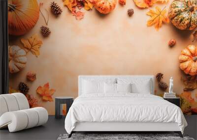 A pumpkin and a few leaves are arranged in a circle Wall mural