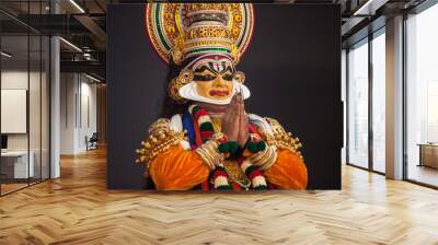 Kathakali dancer in yellow facial makeup depicting subhramanya god Wall mural