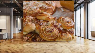 homemade boston cake and buns next to rolling pin on wooden tabl Wall mural