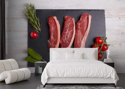 Picanha fresh raw meat with vegetables on wooden table  Wall mural