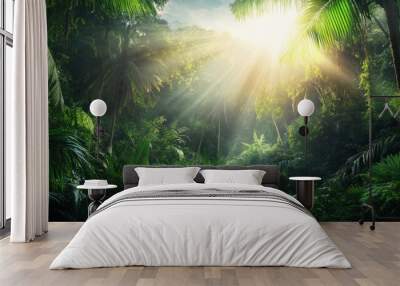 A lush green jungle with a clear blue sky. Wall mural