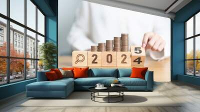 2024 end year to Happy New Year 2025 with  coins money stack growing with magnifier glass. Money saving, Inflation, tax, cash flow, Job search, hiring and research development concepts Wall mural