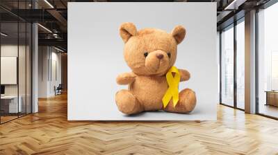 International Childhood Cancer Awareness month, Children toy with golden color Ribbon for supporting kids living. Healthcare and World cancer day concept Wall mural