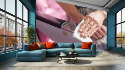 woman clean seat by wet wipe tissue in airplane or public transportation, protection Coronavirus disease (COVID-19 ) infection. New Normal, safety and  personal hygiene concepts Wall mural