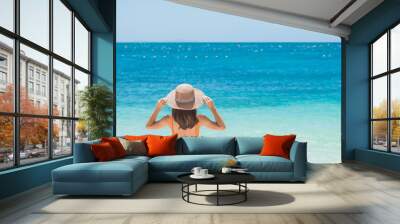 Woman tourist in orange swimsuit and hat, happy traveler sunbathing at Paradise beach on Islands. destination, wanderlust, Asia Travel, tropical summer, vacation and holiday concept Wall mural