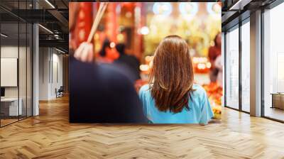 Woman traveling in Wat Mangkorn Kammalawas, Leng Nuei Yee as Chinese temple. Asian traveler visiting at Yaowarat road or Chinatown of Bangkok, landmark and popular for tourist attractions in Thailand Wall mural