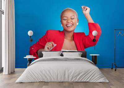 Happy, dancing and a woman in studio with fun energy for celebration, good news or fashion. Excited African person on blue background to celebrate success, positive attitude or dancer moving to music Wall mural