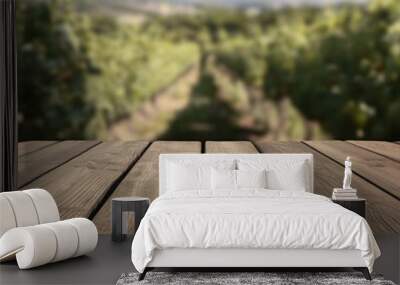 Wooden table top on blurred vineyard landscape background Wall mural