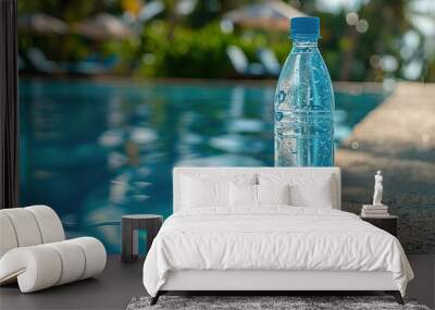 A serene moment captured with a plastic water bottle resting by the pool at a tropical resort in the golden light of afternoon Wall mural