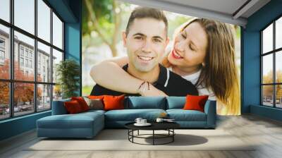 Couple strolling calmly on the warm beach Wall mural