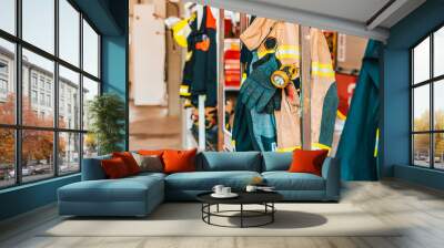 Fire retardant clothing worn by firefighters in case of emergency. Wall mural