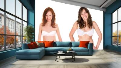 Two attractive young woman wearing bra and undies, isolated in front of white studio background Wall mural