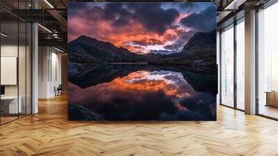 A beautiful sunset over a lake with mountains in the background Wall mural