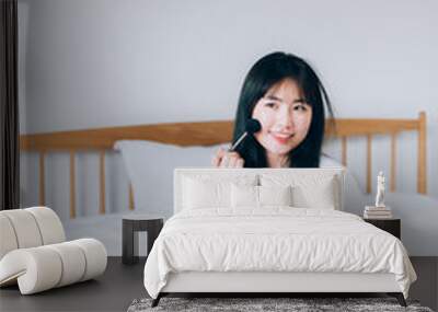 Asian young woman makeup at home Wall mural