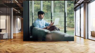 Young Asian business man Wall mural