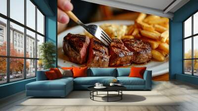 Juicy Grilled Steak with Fries on a Plate - Close-up of succulent grilled steak slices with crispy fries, perfect for a gourmet meal. A delicious feast for food lovers. Wall mural