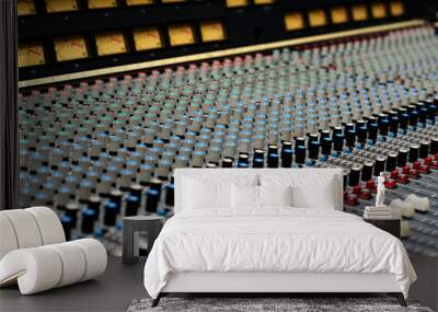 A closeup of a large mixing console. Wall mural