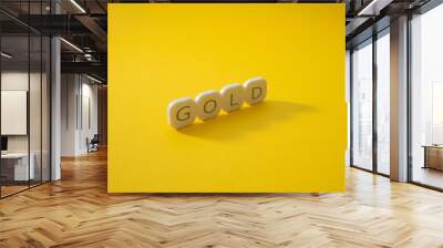 Alphabet gold word block with yellow background. Wall mural