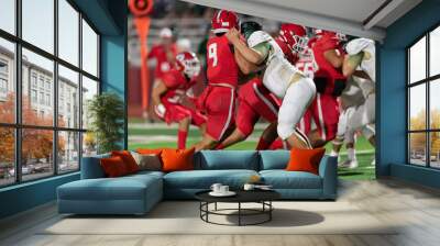 Football players making exciting plays during a game Wall mural