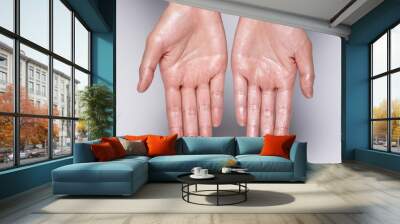 glossy hand. wet hands. Wall mural