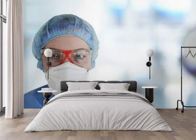 Doctor or Nurse with safety mask and protection glases and clothes for virus protection  Wall mural