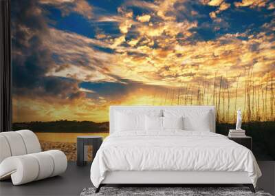 Sunset over the beach and dunes at Pawleys Island, SC, USA, looking across the inlet to the mainland. Wall mural