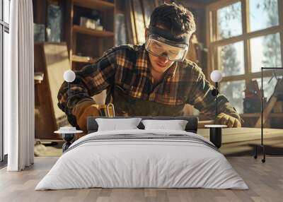 Craftsman working with wood in a workshop, wearing safety gear and focused on details. Wall mural