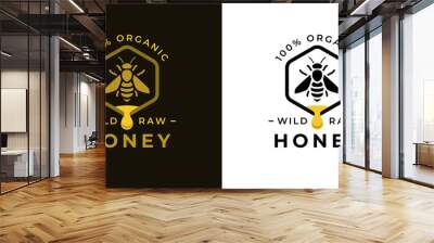 100% Natural wild raw organic honey logo label concept with bee symbol inside hexagon honeycomb nectar drop sign. Beekeeper farm badge brand identity template. Vector illustration.  Wall mural