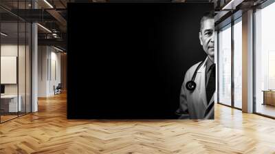 Black and white photorealistic studio portrait of a male medical doctor on black background. Generative AI illustration Wall mural