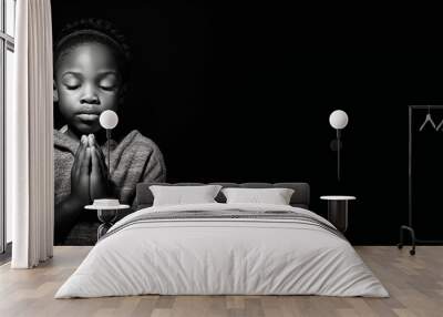 Black and white studio portrait of a young child praying banner on black background. Generative AI illustration Wall mural