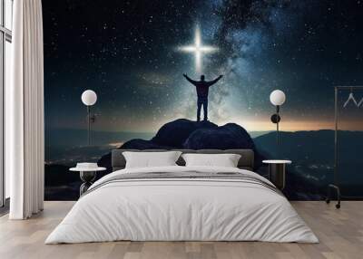 Christian cross symbol in the night sky with silhouette of person with their arms raised worshipping God. Generative AI illustration Wall mural