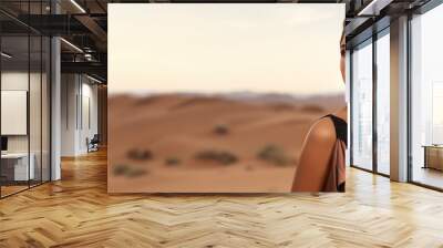 Cosmetic beauty banner with close-up portrait of a beautiful woman and desert dune sand backdrop Wall mural