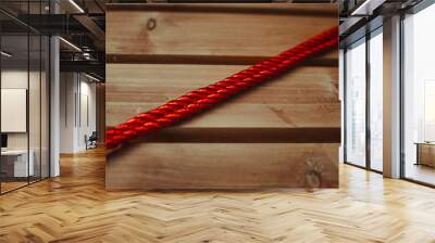 red rope with wooden background Wall mural