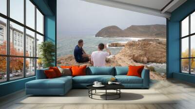 views from the cliffs of mediterranean sea with a castell and guys  Wall mural