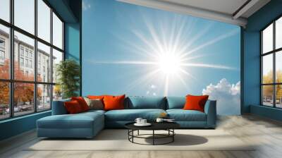 Sun's Radiance: A bright sun starburst against a vibrant blue sky with fluffy white clouds.  Wall mural