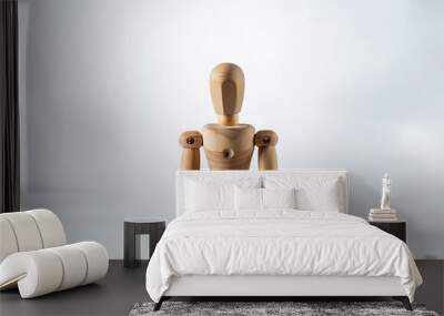 Wooden figure holding a model laptop. Wall mural