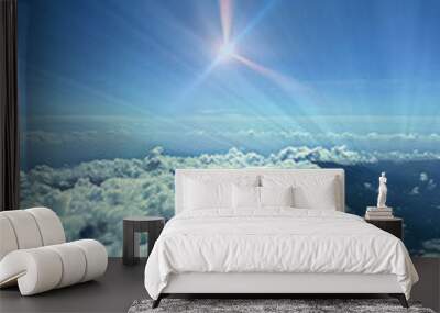 Aerial photography above the clouds - Rays of light with a shining star Wall mural