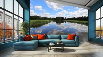 Beautiful view over Dutch water landscape during the summer with a beautiful blue sky and white clouds. Wall mural