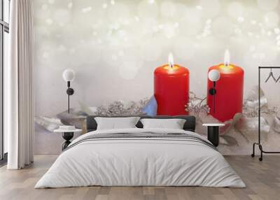 two burning candles with silvery eucalyptus leaves, copy space Wall mural