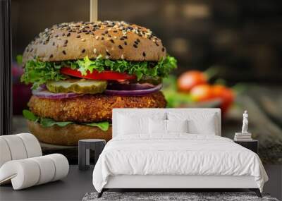 A healthy fast food option: a vegan rye burger topped with fresh vegetables, presented on an old wooden background. Wall mural