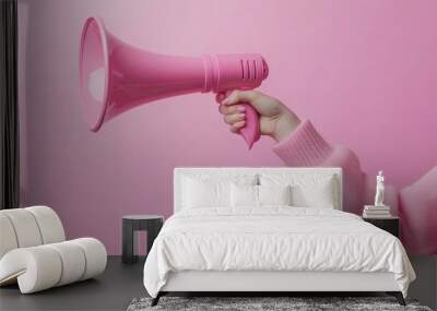 arm extended holding a pink megaphone against a pink backdrop Wall mural