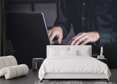 Businessman using a smartphone and notebook in a moddy office Wall mural