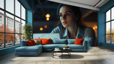 Focused businesswoman analyzing market data with graphs and charts for strategic sales planning and production growth Wall mural